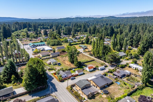 Tall redwood trees surround the perimeter of Fieldbrook.