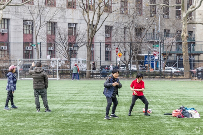 Locals use Columbus Park to practice Tai Chi in Chinatown.