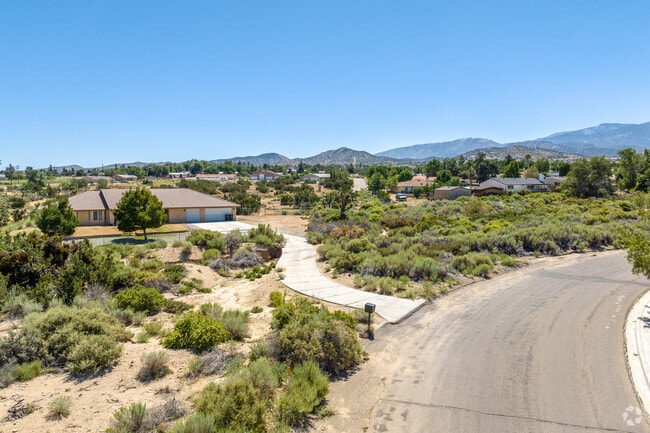 A residential street in Phelan, where single-family homes seamlessly blend with the desert.
