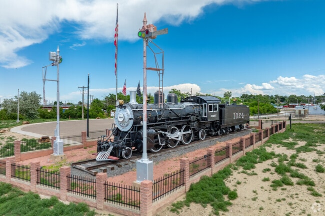 As you first drive into La Junta, Colorado, a striking sight greets you—a long freight train often rolling through town, a powerful reminder of La Junta’s deep-rooted railroad history and its role as a vital transportation hub.