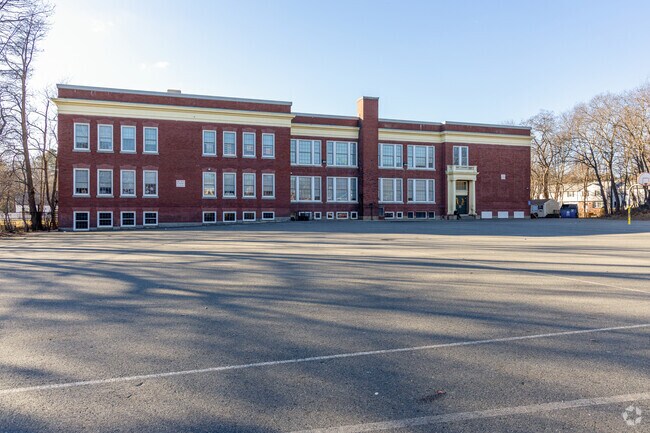 The backside and parking area for the Greenwood School in Wakefield, MA.