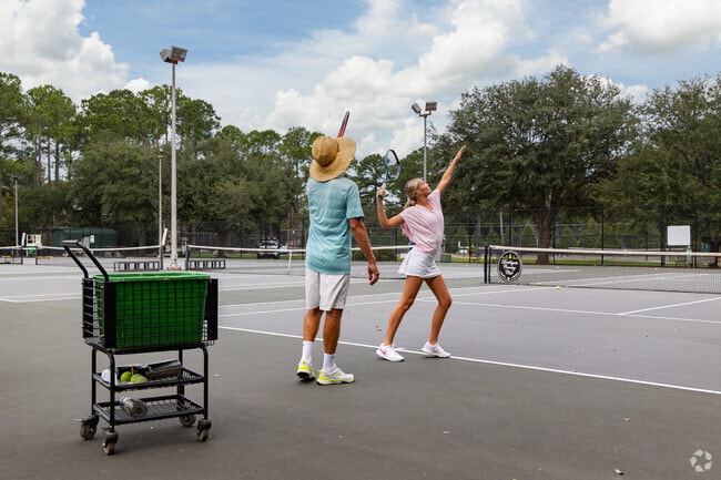 Take tennis lessons at the Doublegate Country Club.