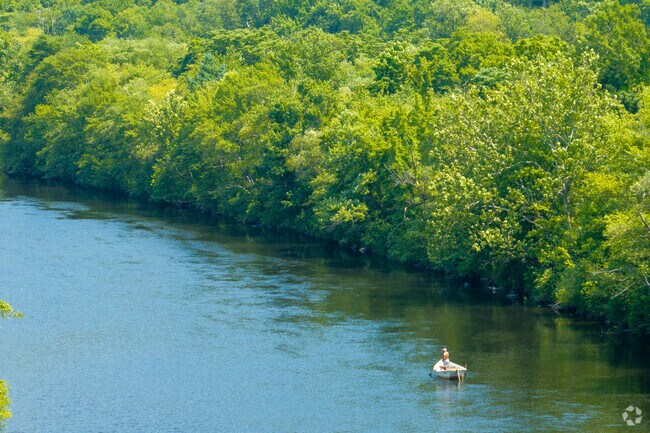 A man navigates calm waters on the Lehigh River in Bowmanstown, Pennsylvania.
