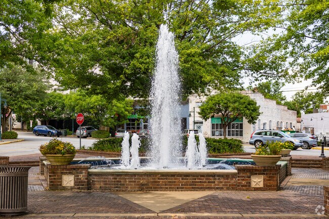 Locals from Historic Waverly can relax on a shaded bench by the water fountain at Five Points.