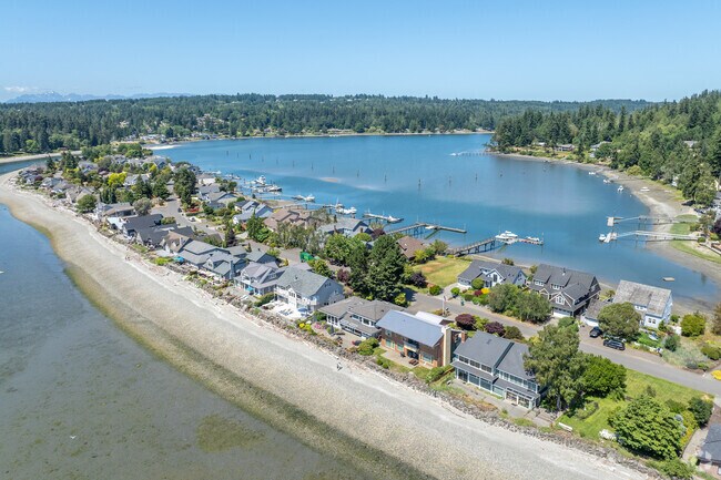 Indianola features homes that seamlessly blend into the surrounding forest and bay.