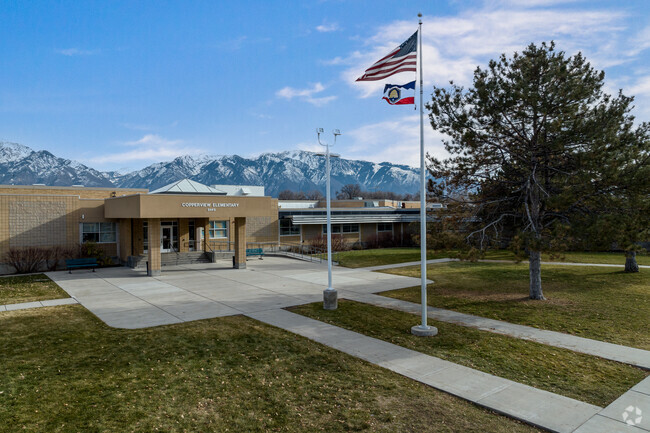 Snow capped mountains tower behind Copperview Elementary School.