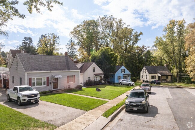 The suburban streets breathe, Cape Cod homes in quaint heart of Howard Park.
