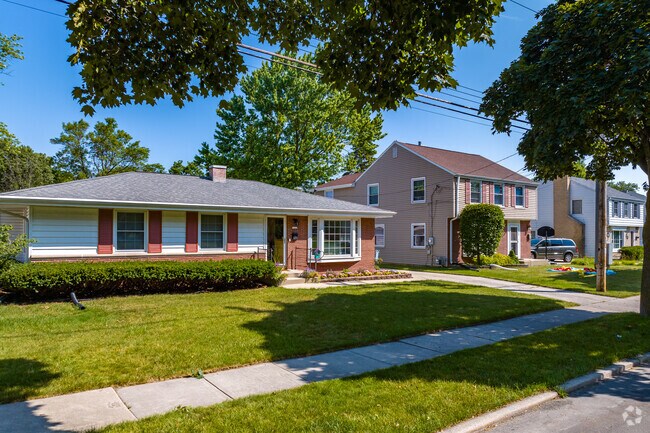 A row of homes shine in the Wedgewood neighborhood.
