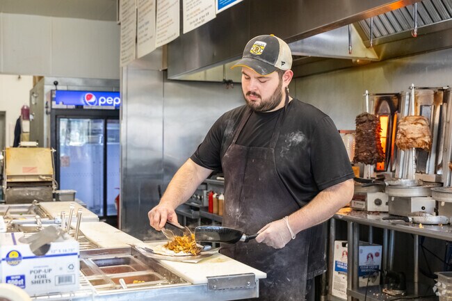 A chef prepares a gyro at the popular local favorite, Pita, in Chelmsford.