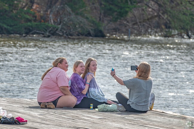 Deep River locals enjoy catching up with friends around Oak Hollow Lake’s shoreline.