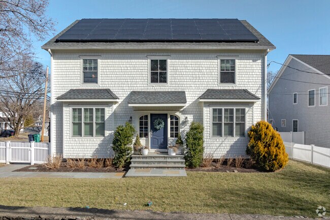 This stunning modern colonial in the University neighborhood oozes cozy curbside charm.