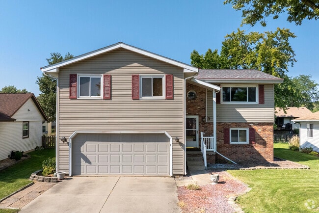 Large split-level homes offer two car garages and ample yard space.