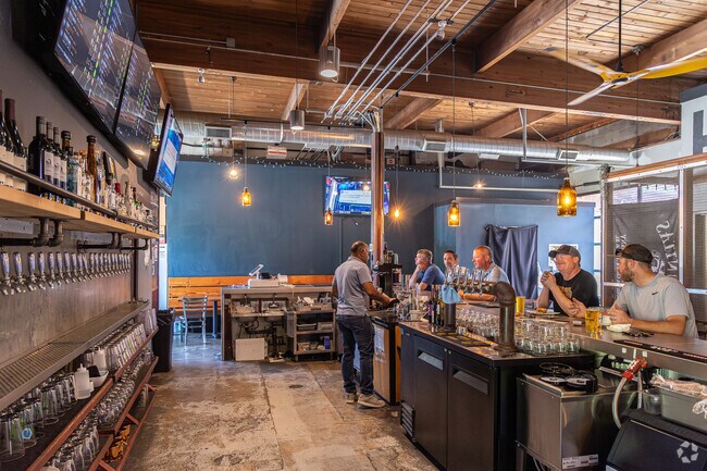 Hop N Cork offers comfort food bites & draft beer at this rustic neighborhood hang out.