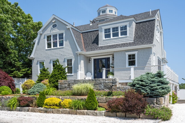 Grand custom-built residents have replaced many of the older cottages on Monomoscoy Island.