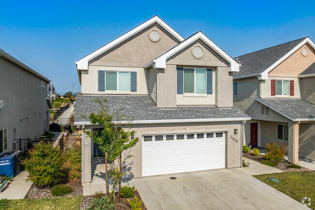This newly built 2-story home has stucco siding and a two-car garage in Oasis.