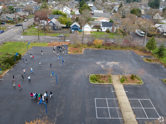 Kids enjoying the Basket Ball courts.