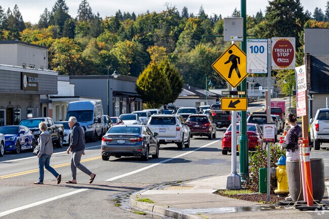 A young woman waits for the trolley in Gig Harbor North.