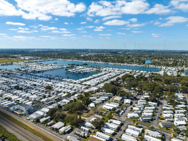 Aerial view of mobile homes on a lake in Pembroke Park.