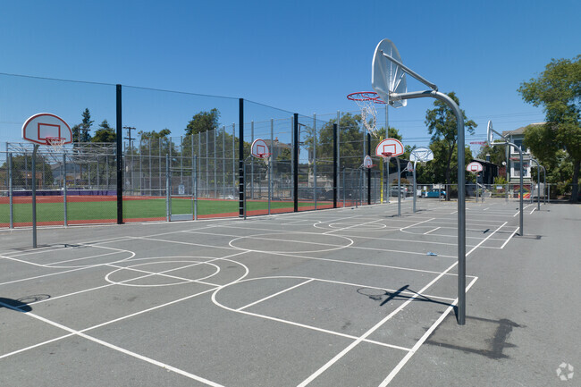 Kids cluster to the basketball courts during their breaks at Emerson Elementary School.