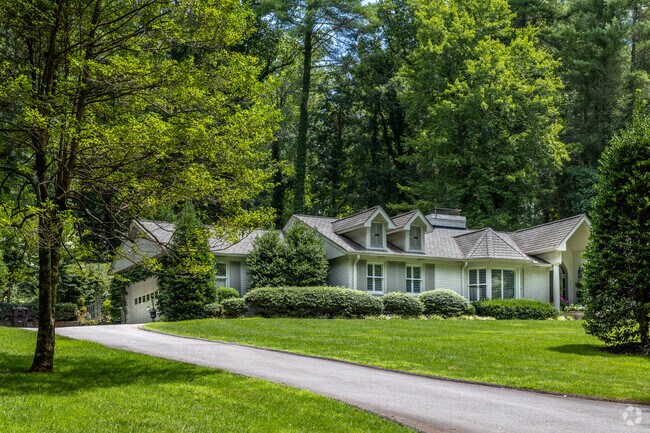 Rustic dwellings meet refined detail on the covered shady streets of Biltmore Forest.
