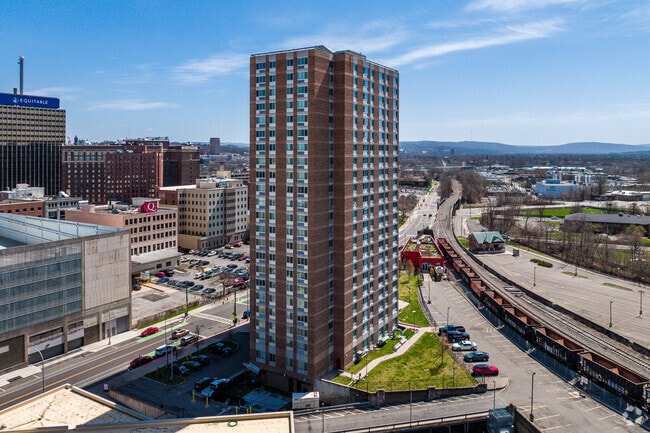 Downtown Syracuse, being a business district, has apartments and condos but no houses.
