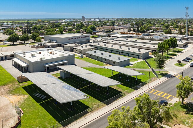 Large solar panels on the campus of John Muir Middle School help to offset their energy bill.