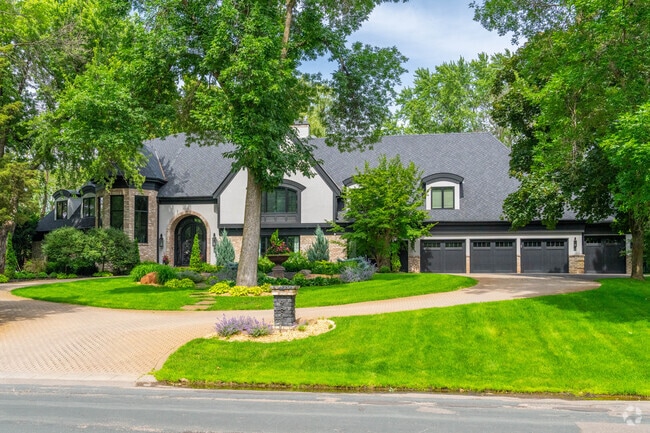 A modern house with a multi-car garage in Rolling Green/Hilldale, Edina.