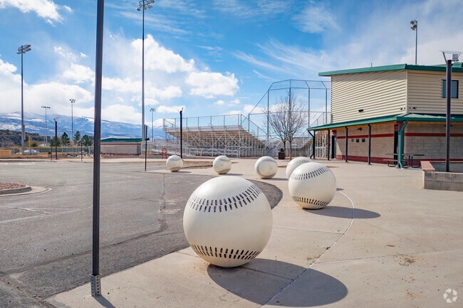 Centennial Park in Rifle, Colorado, is a vibrant gathering place, featuring scenic trails, a splash pad, and a playground. Home to baseball fields where local teams hit home runs, this park brings the community together for sports, picnics, and outdoor fun in a beautiful riverside setting.