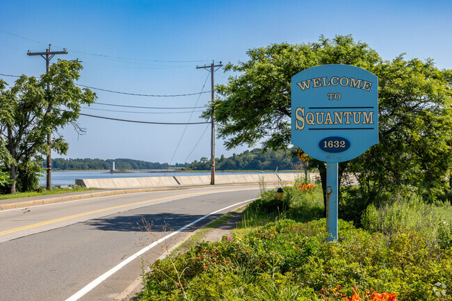 A beautiful hand painted sign welcomes you Squantam.