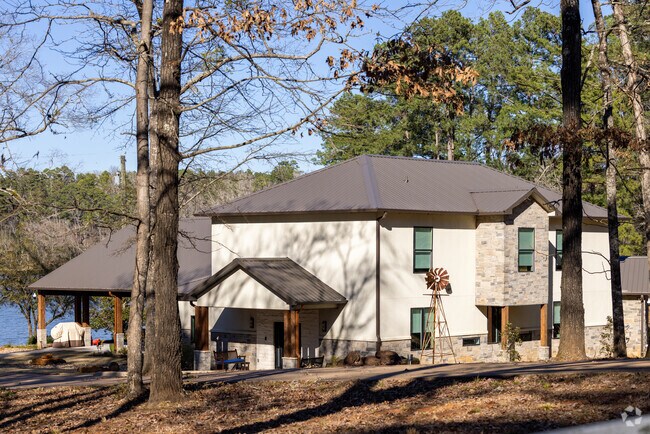 Find Contemporary home builds along Lake Jacksonville in Jacksonville, Texas.