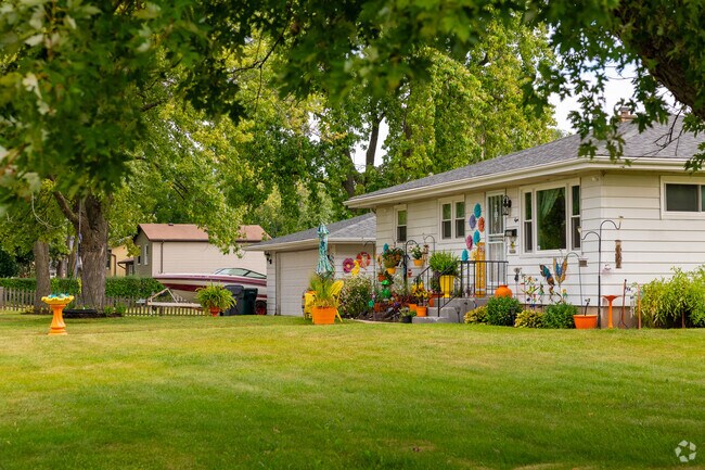 A single story home with colorful decorations in Zion, IL.