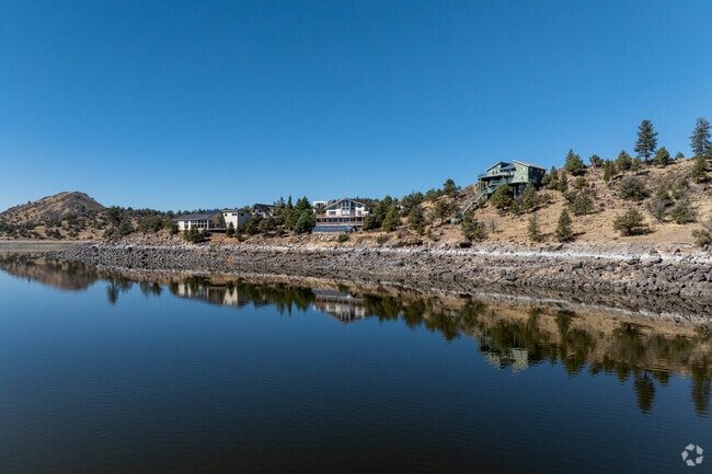 Modern homes overlook Lake Shastina with reflections on calm Northern California waters.