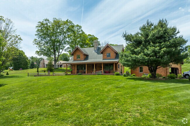 Rustic log cabins in Union can start near $185K and offer quiet living on generous lots.