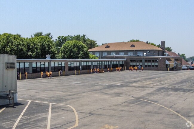 St. Charles Borromeo School uses the parking lot as a school yard.