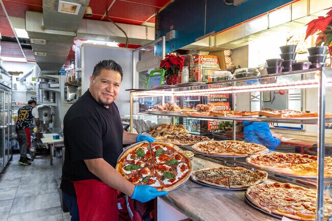 Sorrento's Pizzeria on Avenel Street beckons with its inviting ambiance