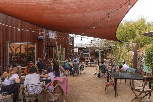 Relax and unwind on the inviting patio at The Hop Shop in North Dodge.