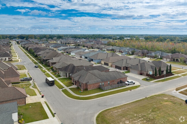 Large subdivisions of cottage-style homes fill Acadiana Wood in Lafayette.