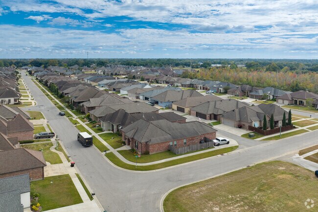Large subdivisions of cottage-style homes fill Acadiana Wood in Lafayette.