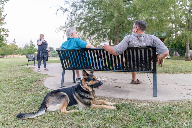 Take your dog to Hynson Dog Park near Tennyson Oaks.
