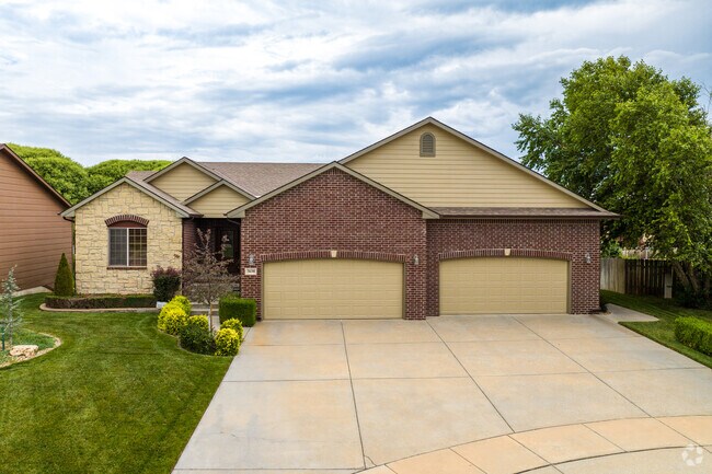 This Tyler's Landing home looks spectacular with the red brick siding.