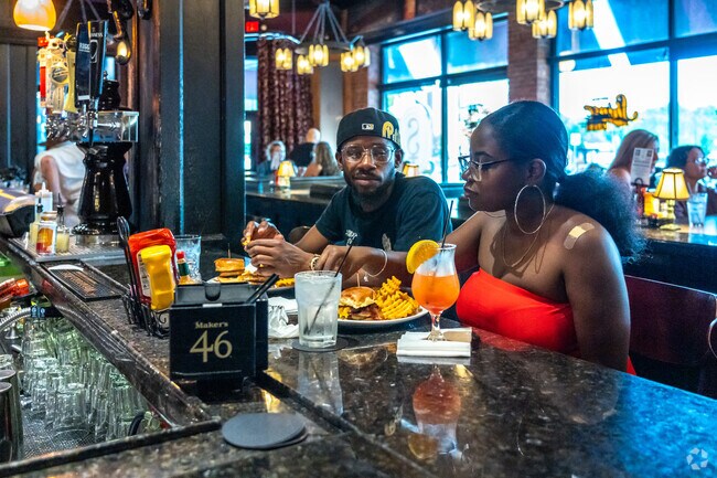 Grab dinner and cocktails at Seven Saints Grill near Hill Street East for a great night out.