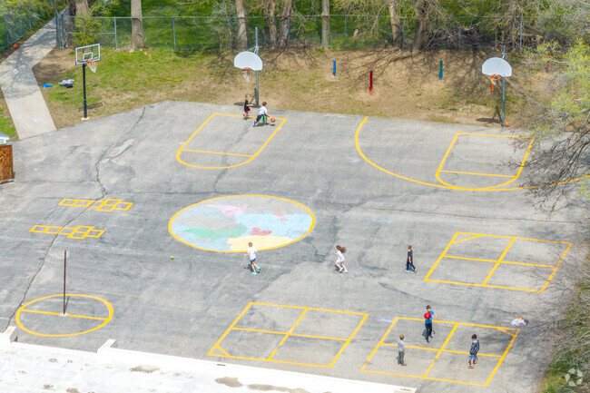 Basketball hoops and other painted games make recess time a lot of fun.
