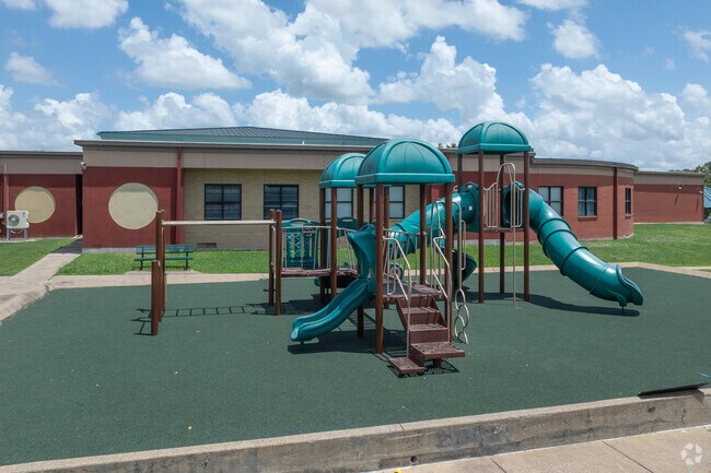 Kids delight in adventures on Neal Elementary School's lively playground.