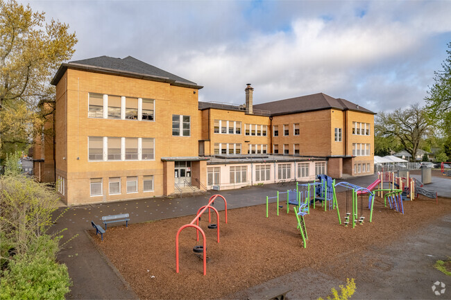 Playground with building in the background with lots of activities.