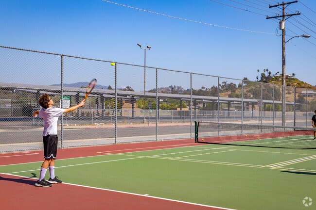 Friends play a round of tennis at Kennedy Park in Granite Hills.