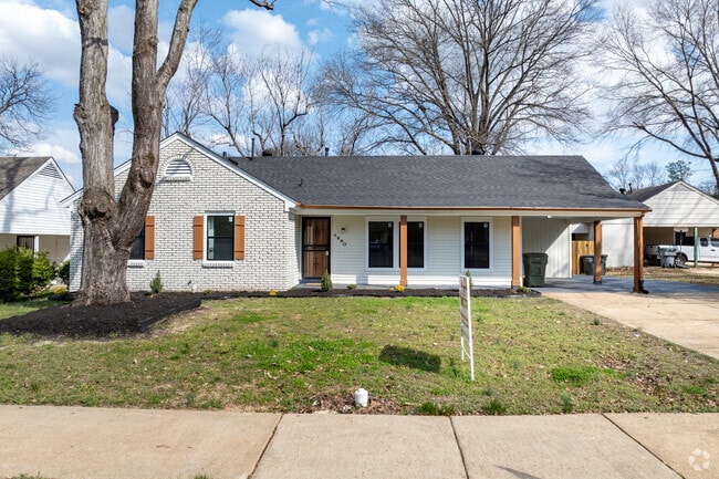 Ranch-style homes with brick exteriors and attached carports are common in Parkway Village.