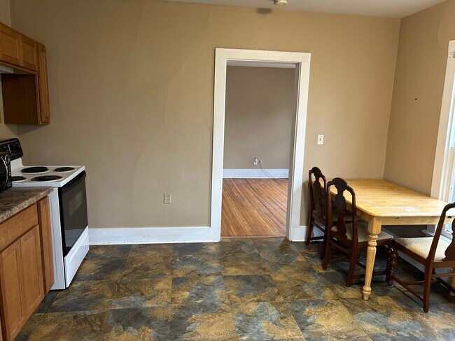 Kitchen looking into living room