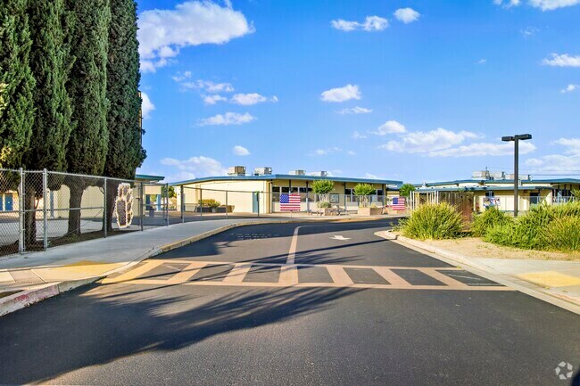 Emile J Ross Middle School in Hughson, Ca sits within a large suburb setting.