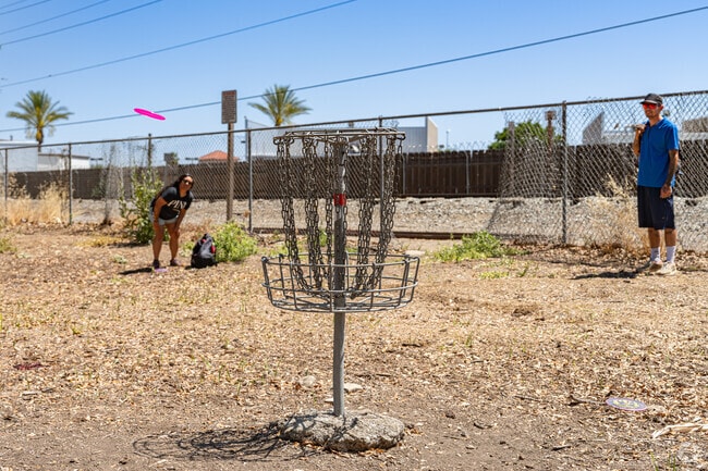 Residents of Southeast Visalia enjoy a quick game of disc golf at Seven Oaks Park.