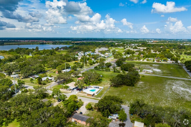 In the center of Wimauma's town there are smaller homes near farmland.